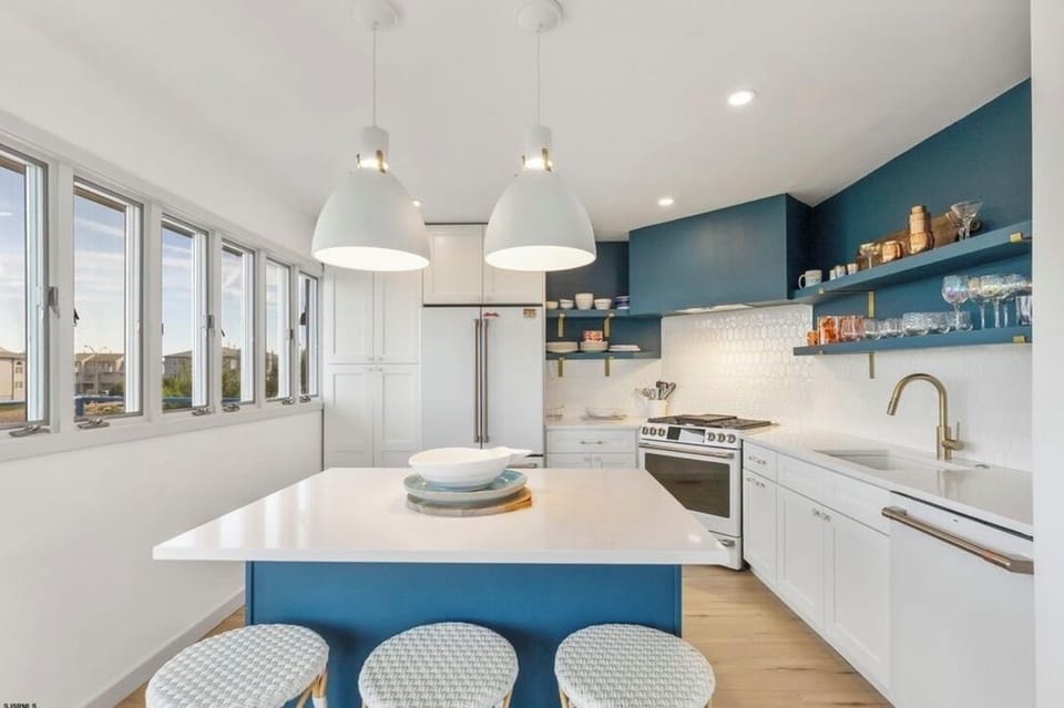Upscale kitchen with island sitting for 3. Wine fridge. 6 burner stove.