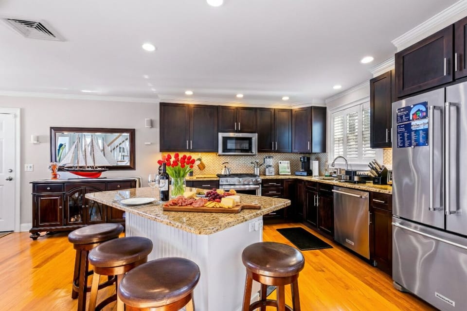 Fully equipped kitchen with modern appliances, ample counter space, and plenty of storage. Bright and functional, perfect for cooking, entertaining, or enjoying meals with family and friends in a comfortable, welcoming setting.