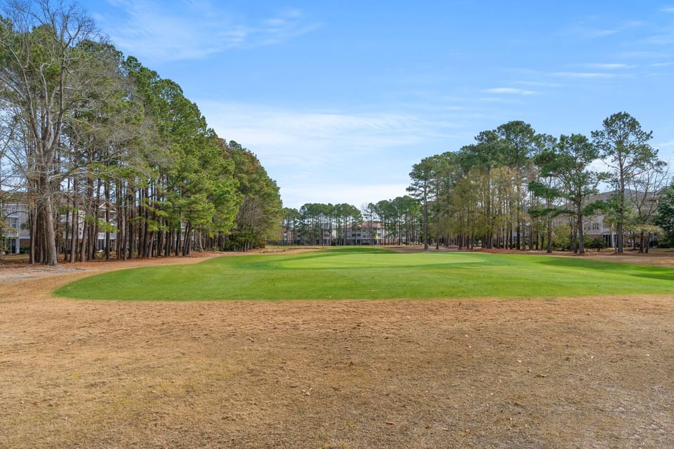 Peaceful, tree-lined fairway views from this on-course getaway