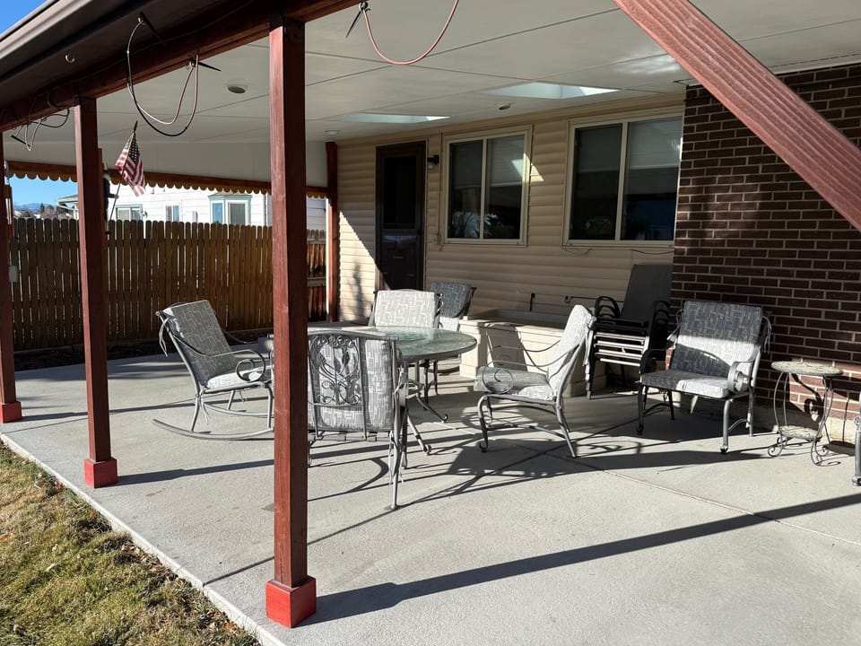 Covered Patio with table, chairs, and additional seating