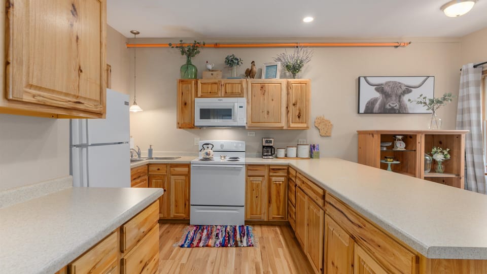 Deluxe Condo | Private kitchen | Full-size fridge, microwave, oven, stovetop