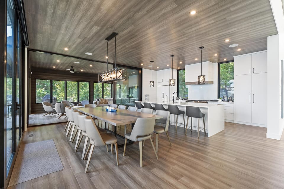 Spacious open-concept dining and kitchen with panoramic windows