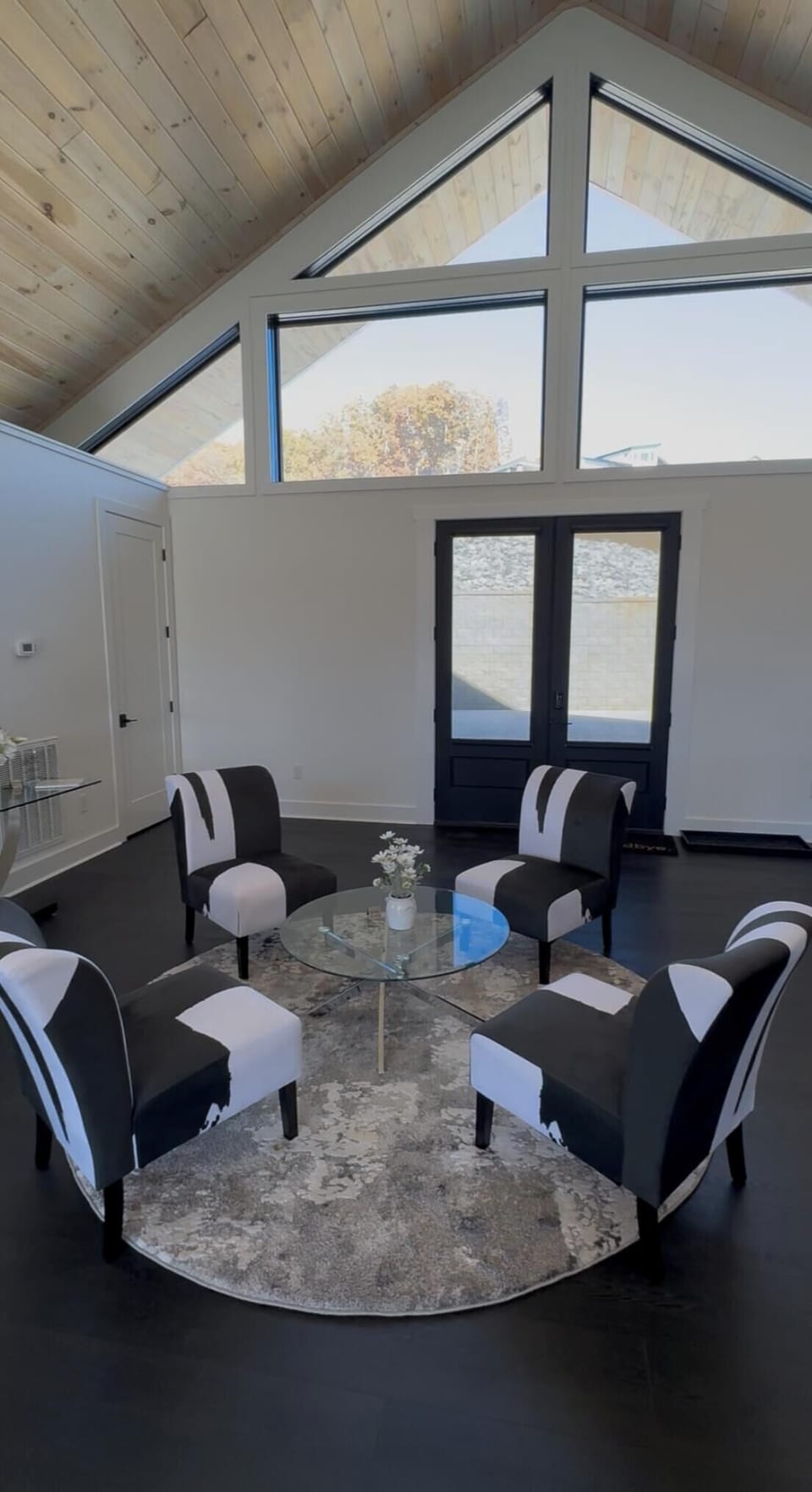 FRONT DOOR AND SITTING AREA IN GREAT ROOM