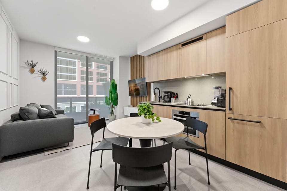 Living room with dining table and kitchen
