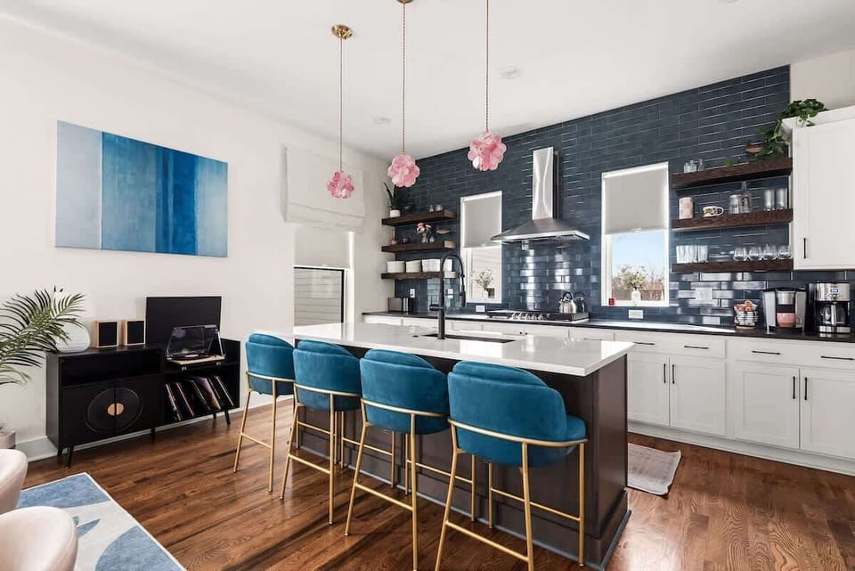 A modern kitchen island perfect for casual meals, coffee chats, and late-night snacks.