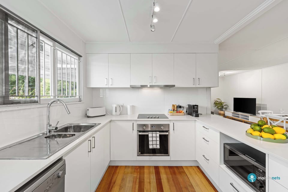 Spacious U shaped kitchen with dishwasher and microwave.