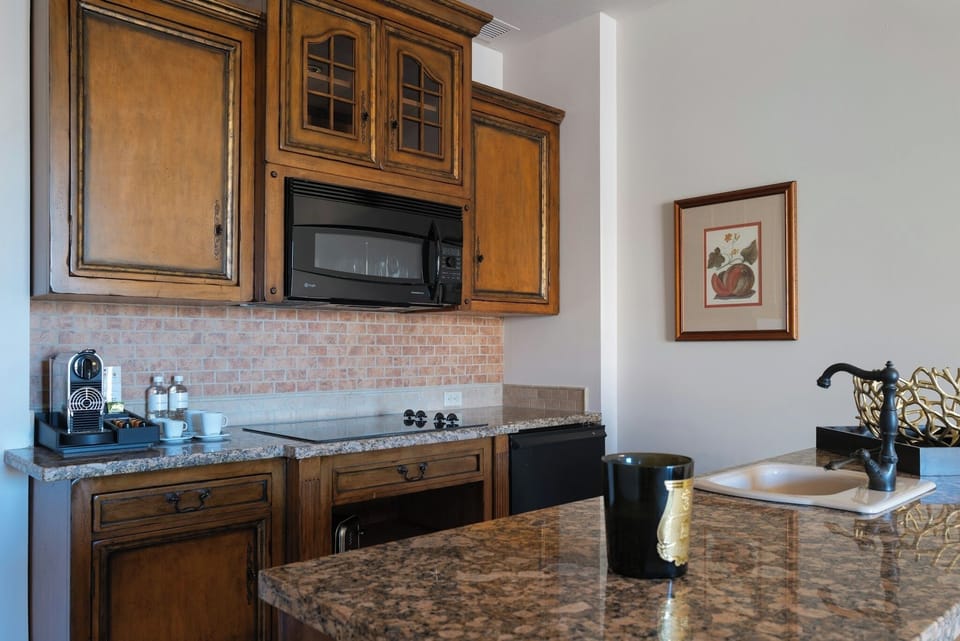 Start mornings with espresso and a handy granite kitchenette.