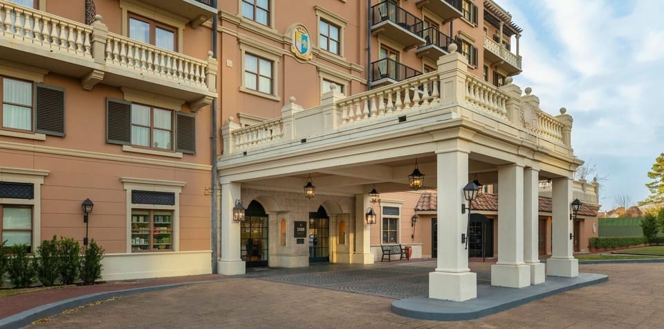 Arrive in style beneath the grand, welcoming covered entrance.
