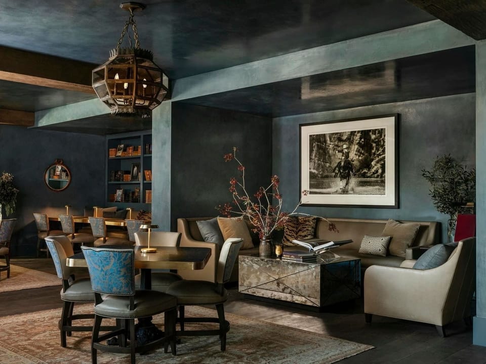 Lounge comfortably on plush seating with soft, ambient lighting.