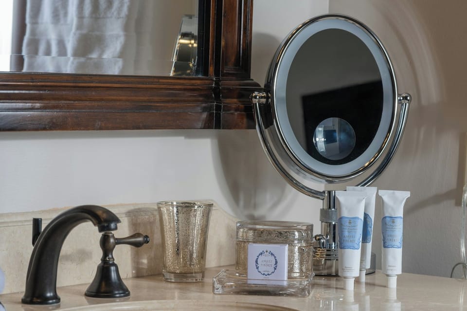 Refresh at the vanity with upscale toiletries and soft towels.