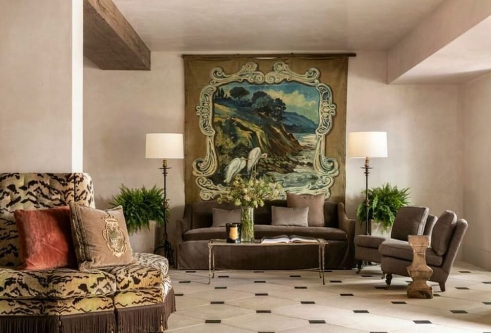 Relax beside statement artwork in a refined, quiet lounge.