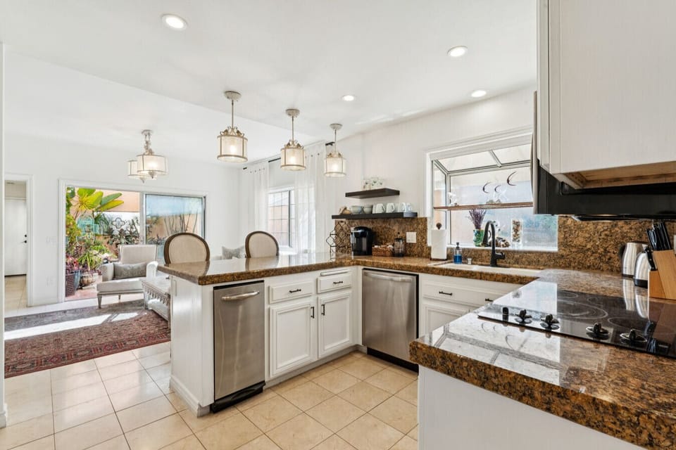 Open-concept kitchen and living area ideal for socializing while cooking.