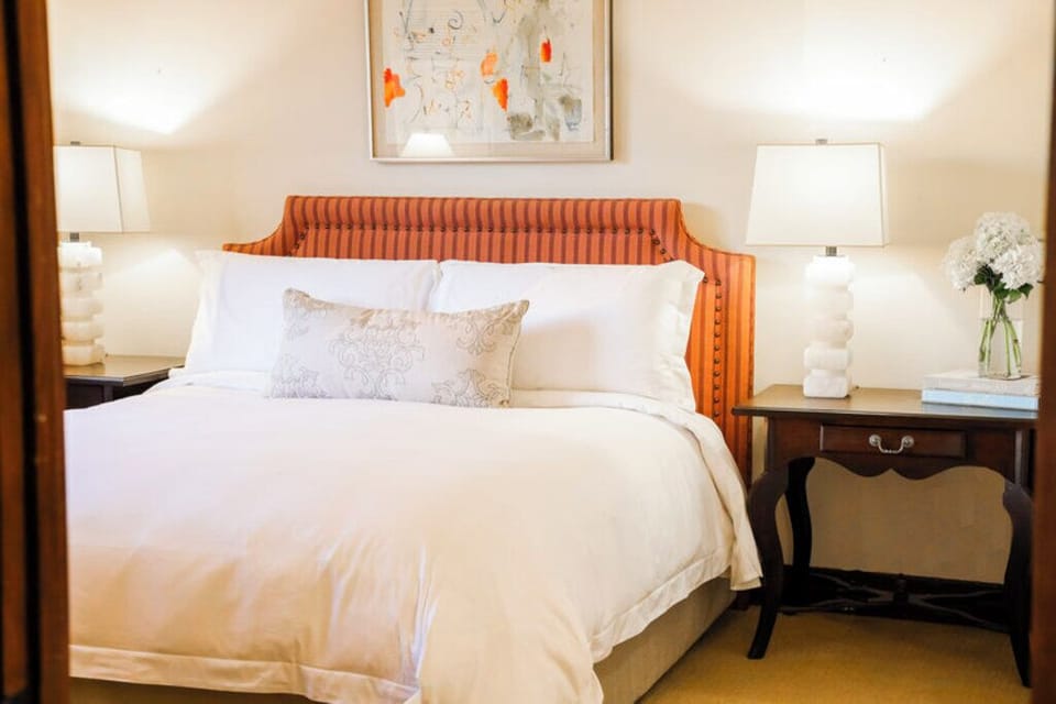 Sink into crisp linens for a deeply restful night’s sleep.
