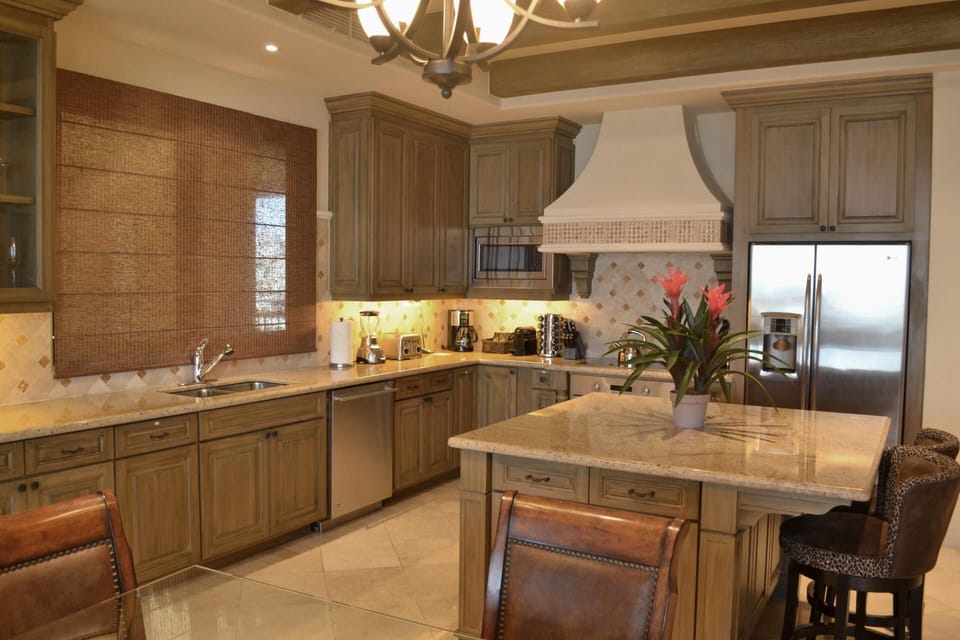 Prep fresh meals in the spacious island kitchen with stainless appliances.