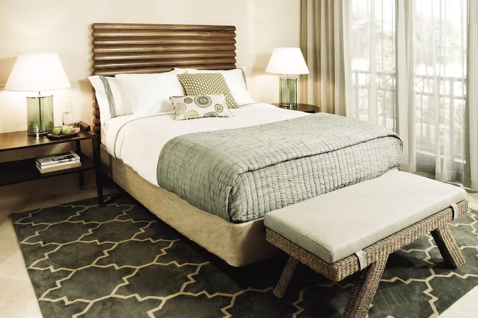 Sink into plush linens and enjoy calming natural light.