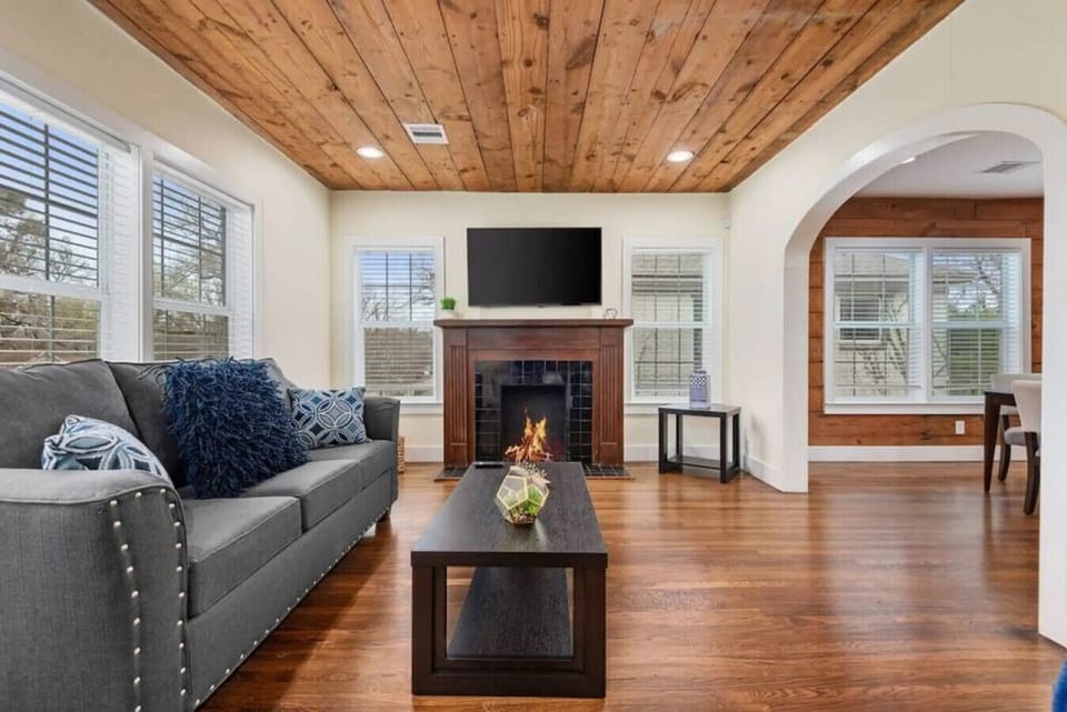 A warm, spacious living room with a fireplace and Smart TV. The perfect place for your family to relax and recharge together.