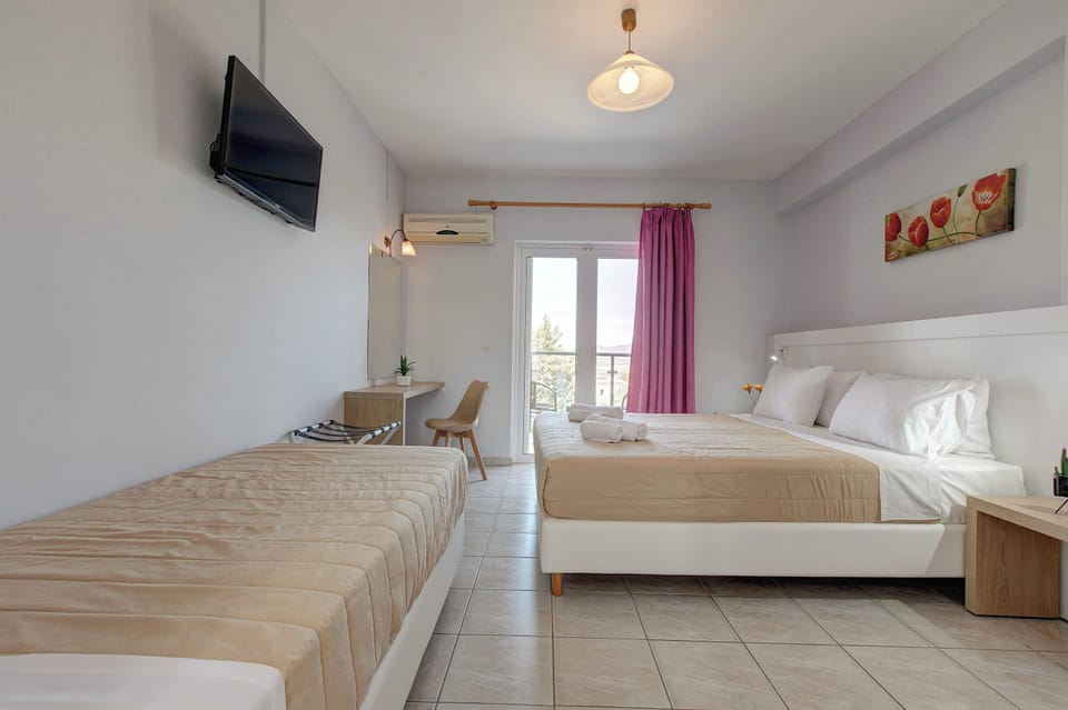 Triple Room with Pool View | In-room safe, iron/ironing board