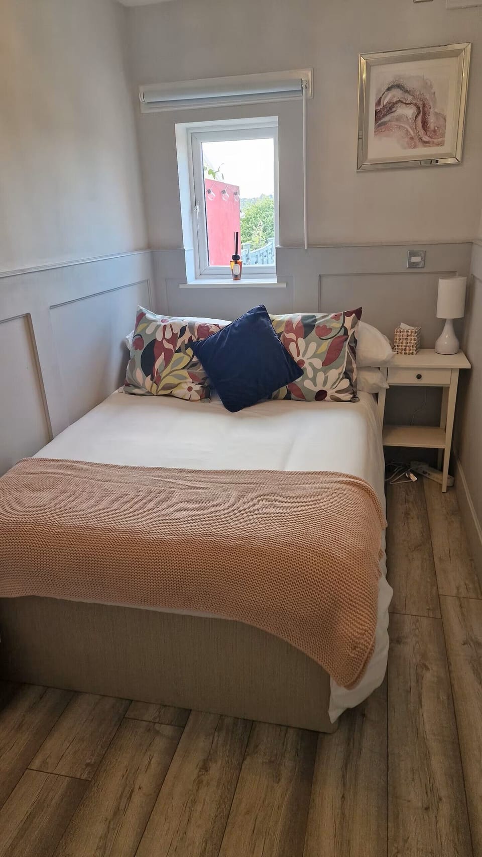 Small double bed (4'), phone charger, wardrobe and heater