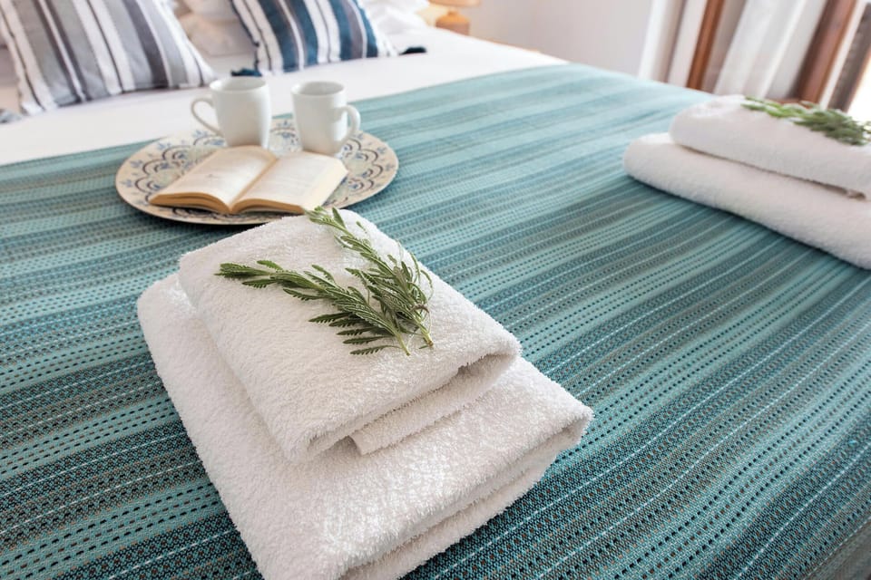 Bedroom 2: Fresh towels and welcoming touches prepared for your arrival, creating a warm and inviting atmosphere. Thoughtful details ensure a comfortable and relaxing stay while exploring the beautiful island of Corfu.