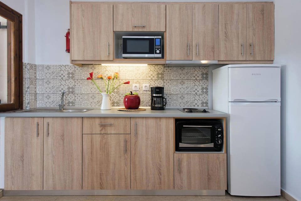 Functional kitchenette with essentials provided, perfect for preparing light meals during your stay.