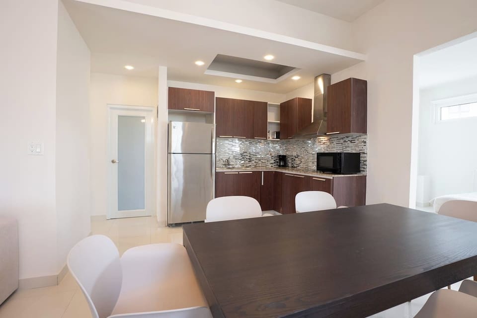 The dining area is perfectly positioned, creating a central hub for meals and conversation.