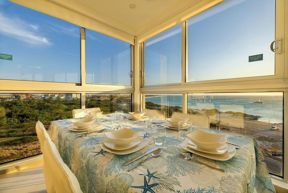 Your morning meals become magical moments at this glass-enclosed dining table, with sweeping sea views creating the perfect backdrop for unforgettable breakfasts.