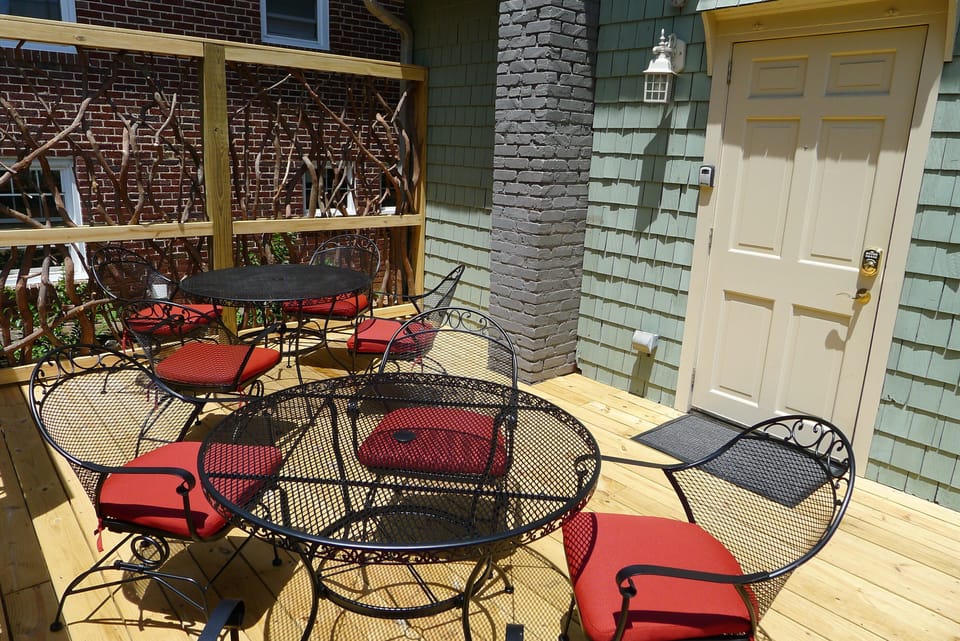Large rear deck with kitchen entry door