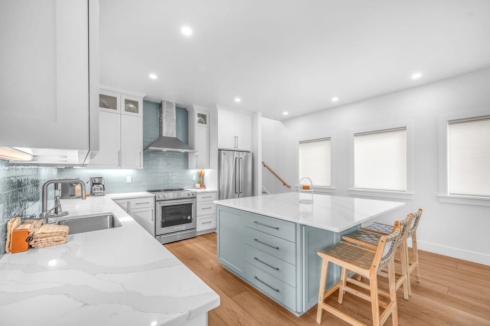 Your spacious kitchen features modern appliances, gleaming counters, and a breakfast bar where you'll start each day.