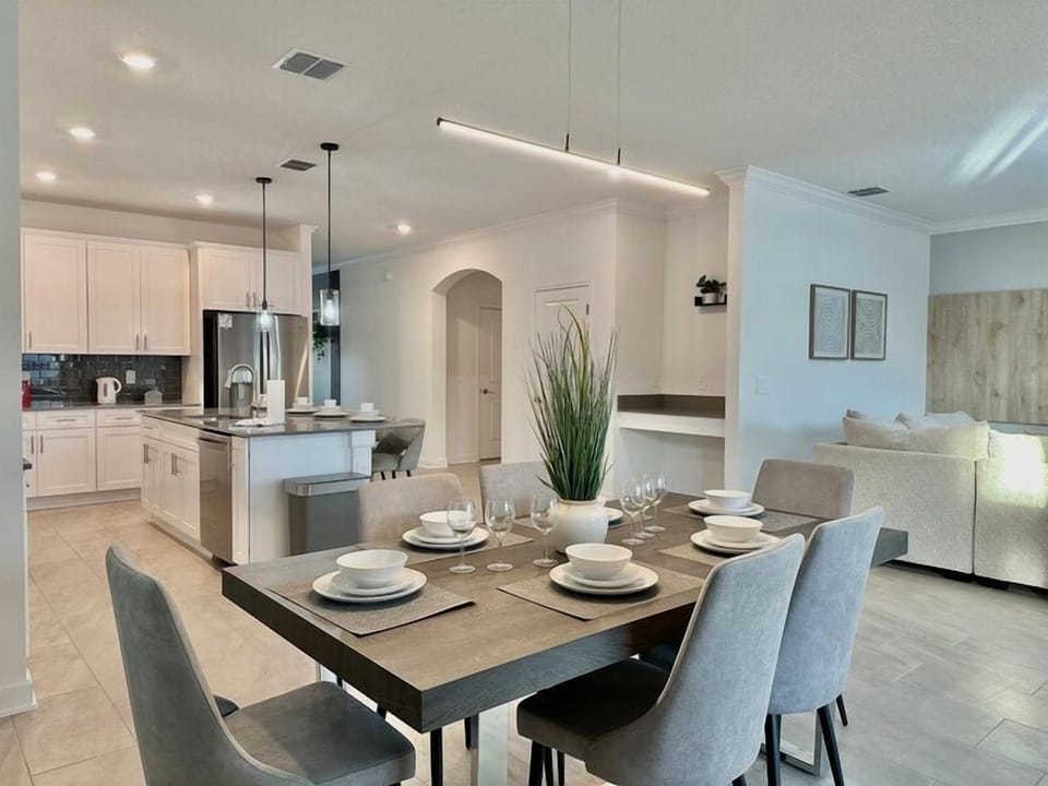 Your open-concept dining and kitchen area creates the perfect space for memorable meals, with modern finishes and thoughtful lighting throughout.