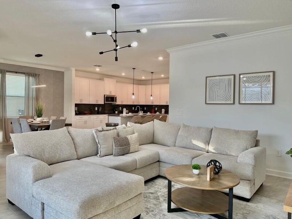 Sink into this plush sectional where you can unwind after your adventures. The open-concept design seamlessly flows to your fully equipped kitchen.