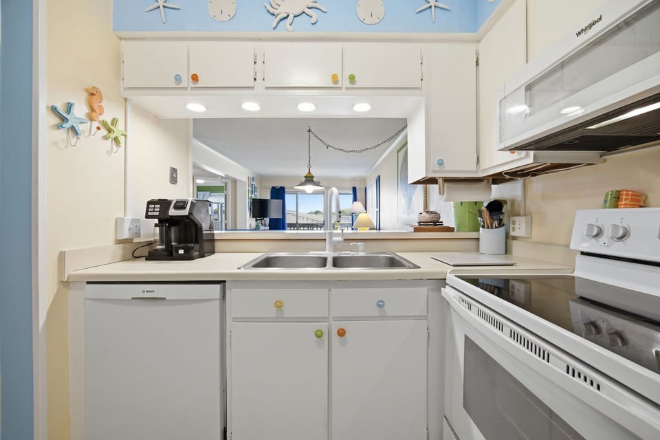 Kitchen with pool and sand dune views