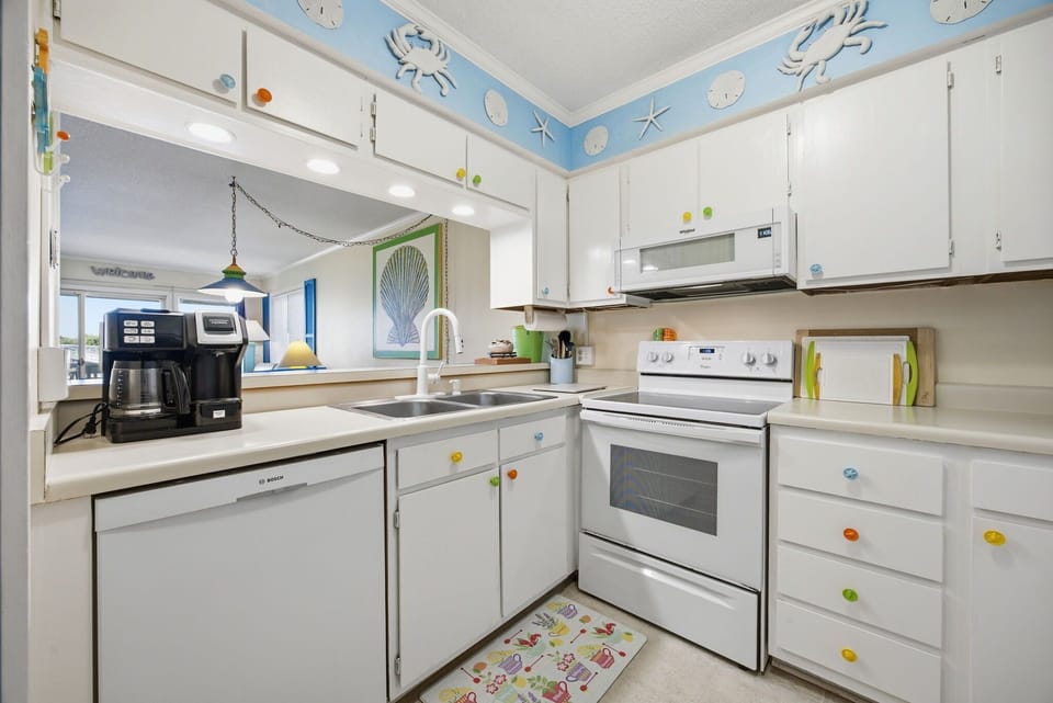 Well stocked kitchen with coffee maker 