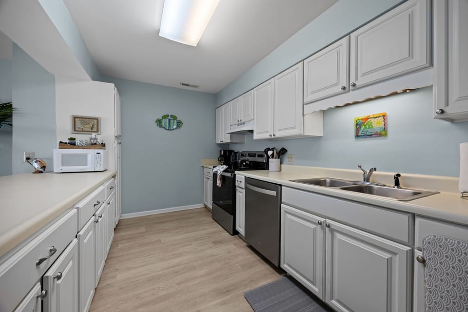 Stocked kitchen with dishwasher 
