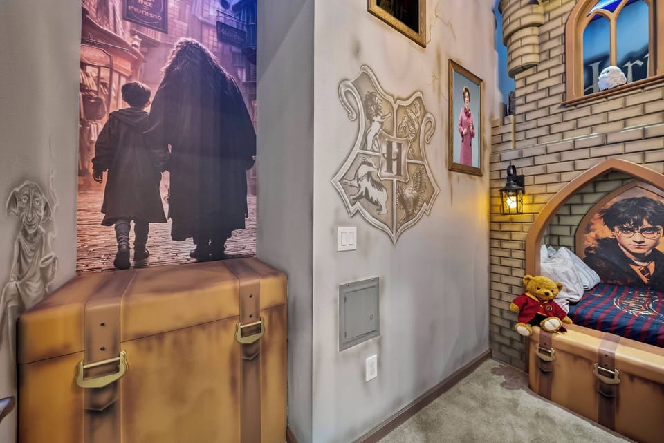 Step into a whimsical haven with charming decor that sparks the imagination, featuring a cozy nook with a plush bed and playful wall murals. The warm lighting and unique details create a delightful atmosphere perfect for all ages.