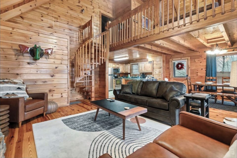 Relax in your cozy cabin retreat with soaring wood ceilings, leather furnishings, and rustic charm throughout every corner.