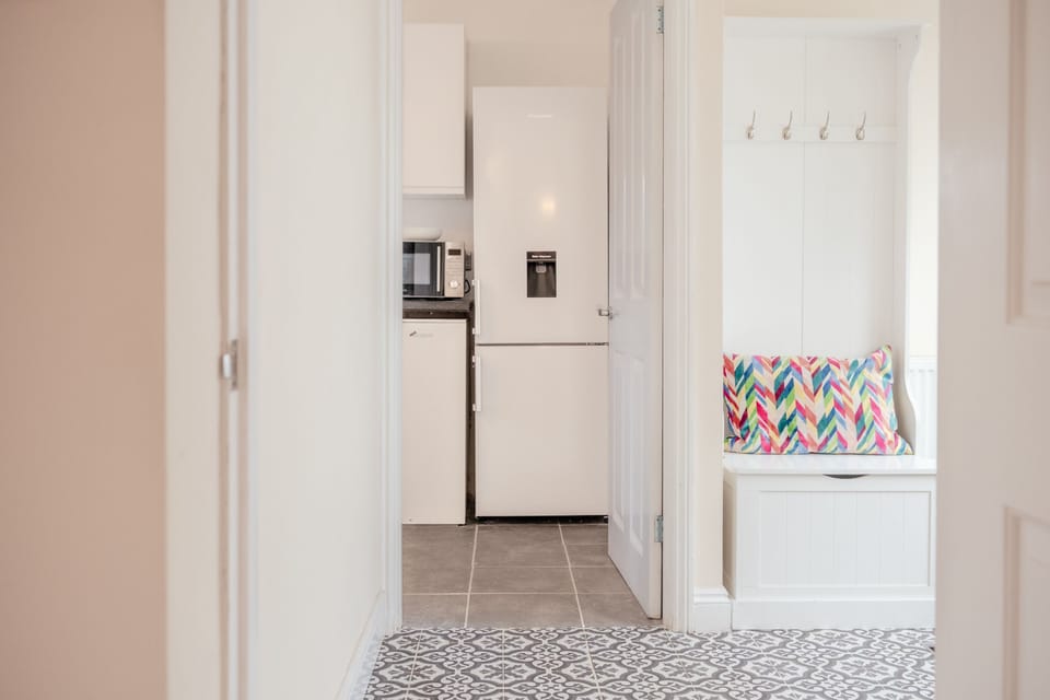 The entrance hallway, looking through to the kitchen