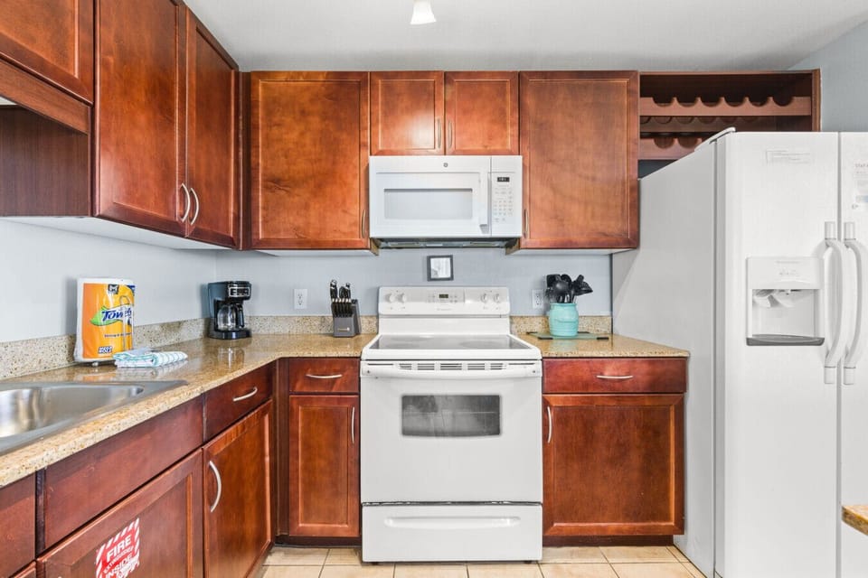 Fully Stocked Kitchen with Lake Views, Island Bar Seating and Drip Coffee Maker