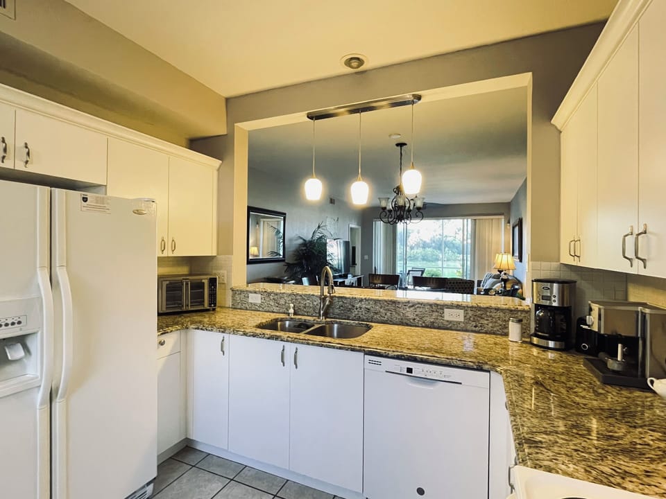 Your fully equipped kitchen features granite counters, modern appliances, and an open layout perfect for cooking together.