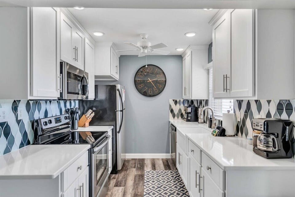 Beautiful, clean appliances and spacious countertops for cooking.
