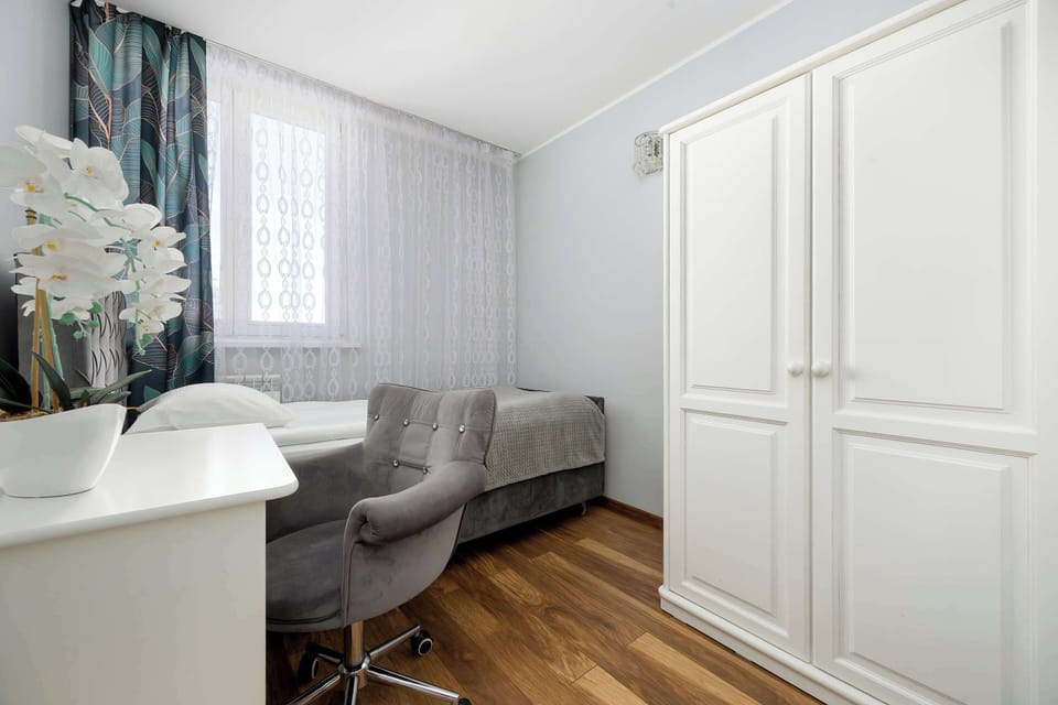 The bedroom's elegant decor creates a calm and restful environment.