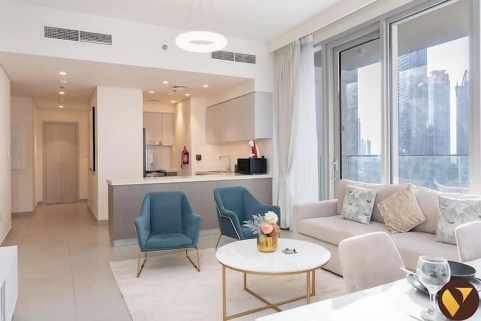 Luxury Apartment, Balcony, City View | Living area | 65-inch Smart TV with cable channels, foosball