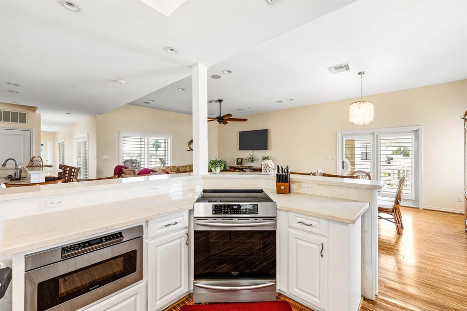 Kitchen Oasis: Discover culinary adventures with a stylish layout and sunlit, open space!