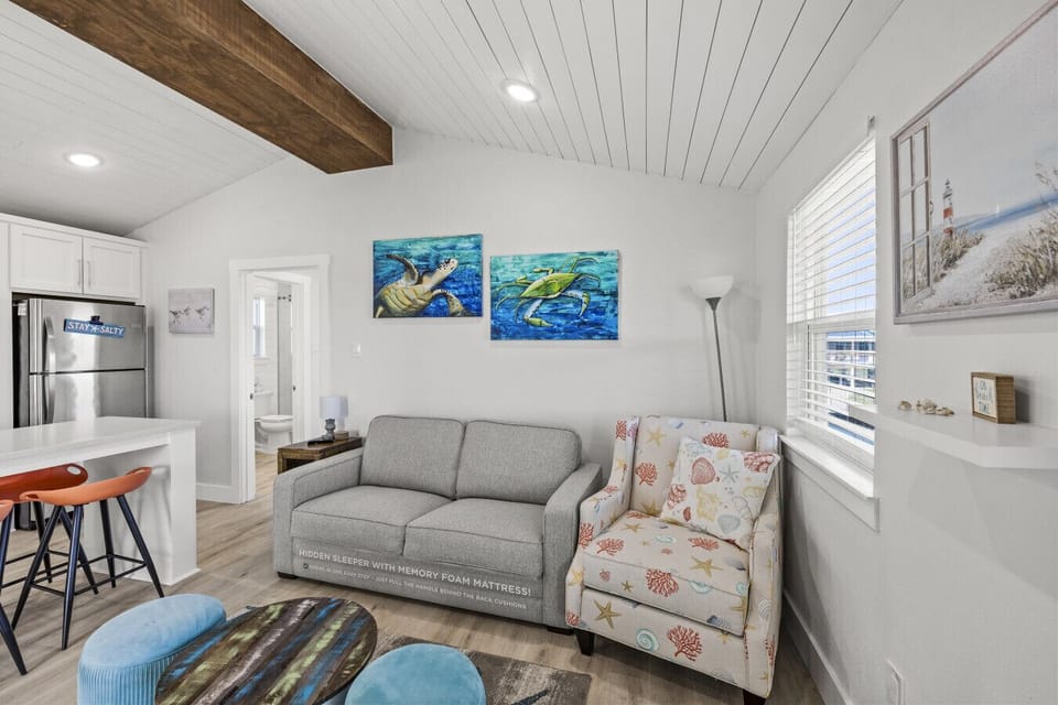 Relax in this cozy seating area filled with coastal charm