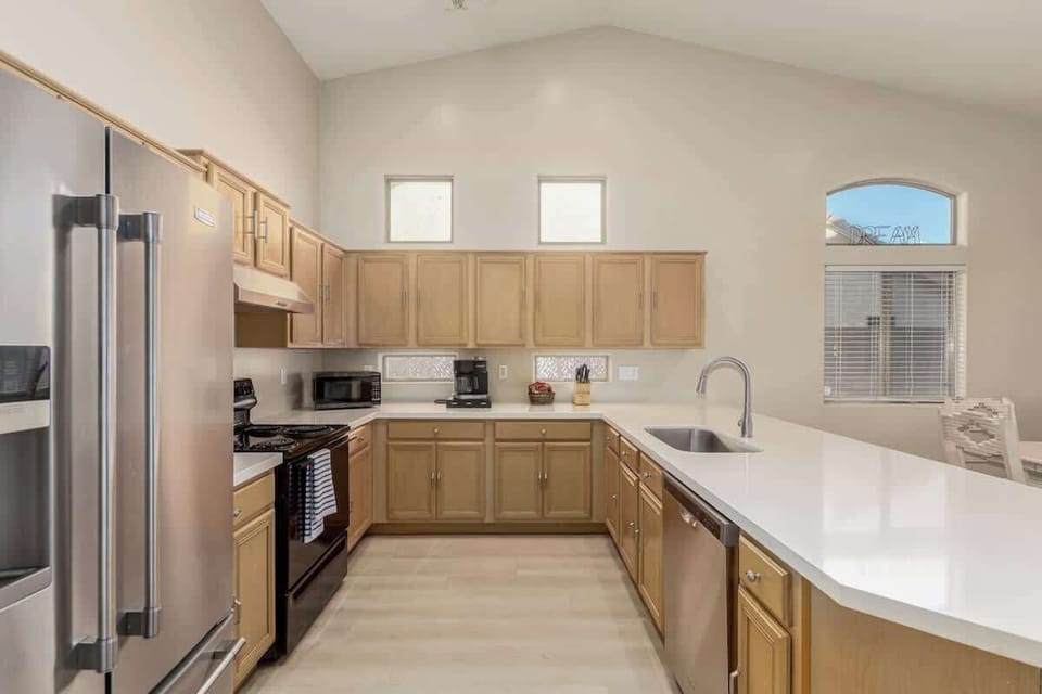 Fully equipped kitchen with island and modern appliances