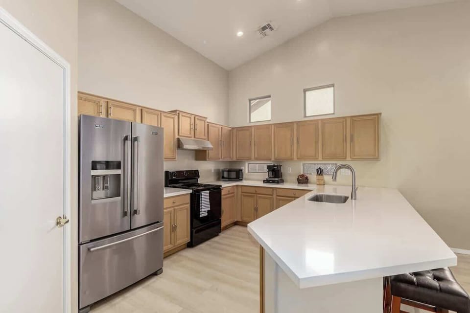 Fully equipped kitchen with island and modern appliances