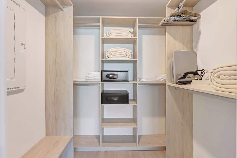 Spacious closet with ample storage for luggage, clothes, and extended stays.