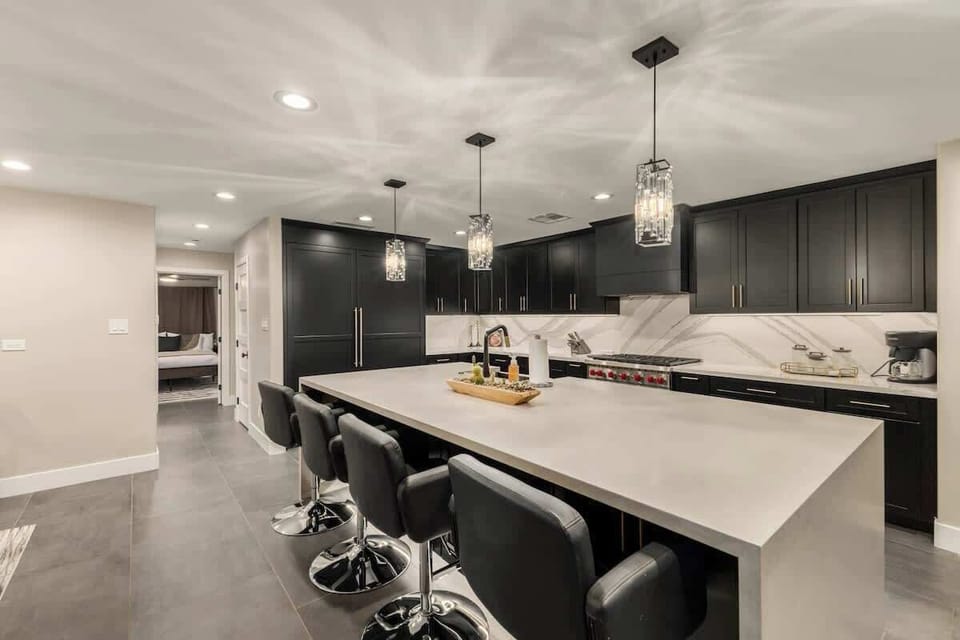 Fully equipped kitchen with modern appliances and two wine coolers
