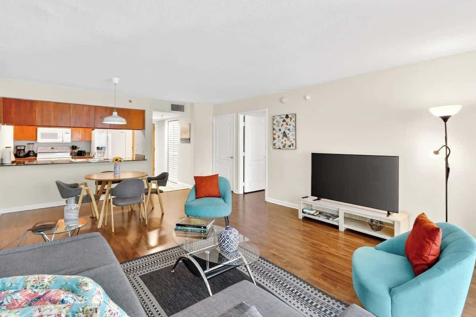 Bright living space with comfortable seating and Smart TV