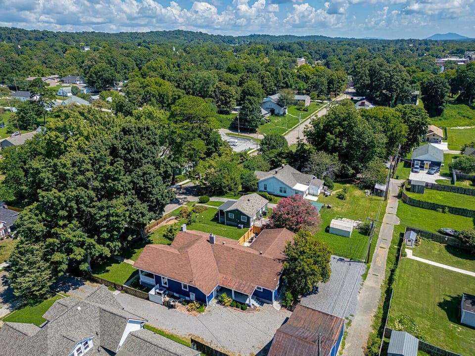 Exterior: Discover a spacious yard surrounded by lush greenery, perfect for outdoor relaxation!