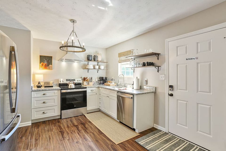 Modern Kitchen: Whip up culinary delights in this stylish, well-equipped space with plenty of charm!